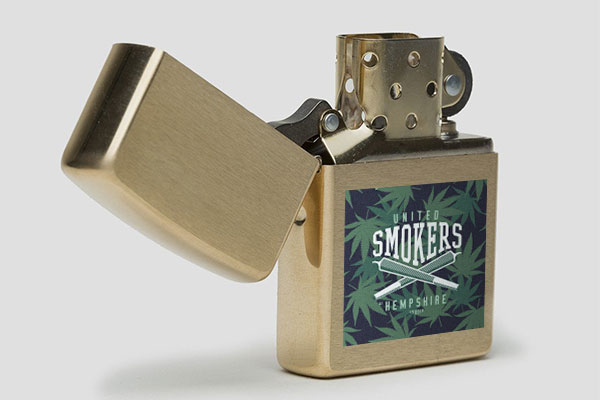 Zippo lighter with branded cannabis sticker applied to it