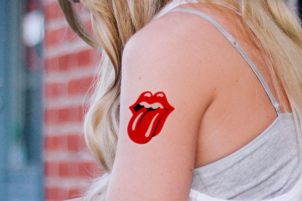 Rolling stone logo temporary tattoo on a woman's arm