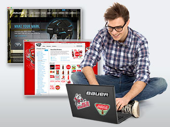 Young man on laptop viewing StickerYou brand partner pages