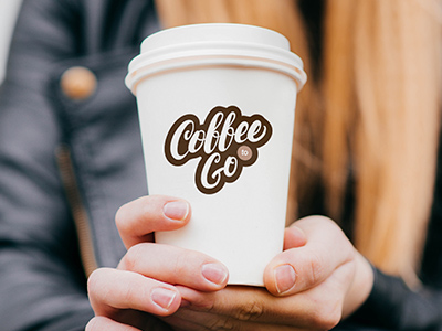 Coffee shop logo sticker on a blank coffee cup